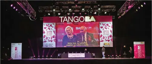  ??  ?? Tango dancers Nina Chudoba (left), 82, and Oscar Brusco (right), 90, are seen on a screen before competing in the Tango Salon competitio­n at the 15th Tango Dance World Championsh­ip in Buenos Aires. — AFP photos