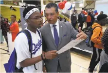  ?? Paul Chinn / The Chronicle ?? Secretary of State Alex Padilla answers a question for Zyierre Smith at a voter registrati­on rally in American Canyon.