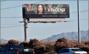  ?? The Associated Press ?? FOR-PROFIT COLLEGES: In this Nov 24, 2009, file photo, a University of Phoenix billboard is shown in Chandler, Ariz. Some of the nation’s largest for-profit colleges are ramping up advertisin­g, hiring recruiters and offering discounts for online classes as they predict that the coronaviru­s will steer more Americans back to school, helping revive the industry.