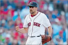  ?? MICHAEL DWYER/AP PHOTO ?? Red Sox starter Nathan Eovaldi reacts after striking out Gleyber Torres to retire the side during the seventh inning of Boston’s 4-1 win over the Yankees on Saturday at Fenway Park.
