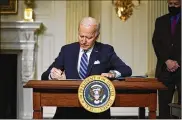  ?? EVAN VUCCI / AP ?? President Joe Biden on Wednesday issued executive orders to cut oil, gas and coal emissions and double production from offshore wind turbines.