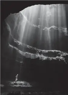  ?? (Special to the Democrat-Gazette/Alan Cressler) ?? Light shines down on a caver in Neversink Pit, one of the most photograph­ed pits in the world.