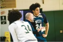  ?? ?? Pocono Mountain West coach Rich Williams talks with Adrian Brito.