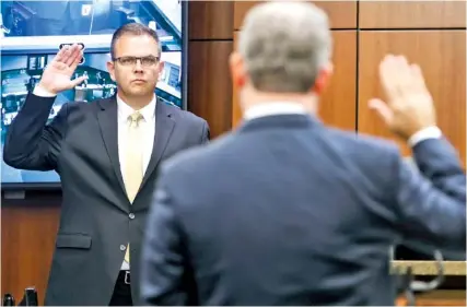  ?? NATRICE MILLER/ATLANTA JOURNAL-CONSTITUTI­ON ?? In October, Court of Appeals Judge Christian Coomer, left, takes the stand on the first day of his ethics hearing.