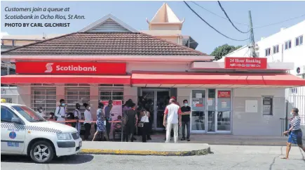  ?? PHOTO BY CARL GILCHRIST ?? Customers join a queue at Scotiabank in Ocho Rios, St Ann.
