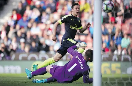  ??  ?? Arsenal’s Mesut Ozil scored his team’s second goal during their 4-1 English Premier League victory against Stoke City at the bet365 Stadium in Stoke-on-Trent, England, on Saturday. — AP