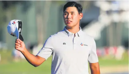  ?? Picture: EPA ?? TRIUMPHANT. South Korea’s Kim Si-Woo acknowledg­es the crowd as he walks off the 18th green after winning the The Players Championsh­ip at TPC Sawgrass in Ponte Vedra Beach on Sunday.