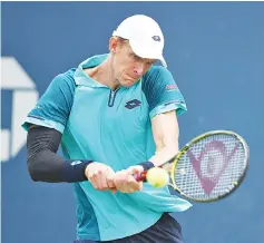  ?? — AFP photo ?? Kevin Anderson of South Africa returns a shot during his first round Men’s Singles match against JC Aragone of the United States on Day One of the 2017 US Open at the USTA Billie Jean King National Tennis Center on August 28, 2017 in the Flushing...