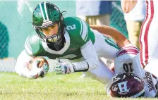  ?? RICKKINTZE­L/THE MORNING CALL ?? Pen Argyl receiver Collin McKeague, 2, is taken down by Bangor defensive player Erik Striba, 10, after the reception Saturday in Pen Argyl. This is the 101st meeting between the two teams with Pen Argyl winning 28-21.