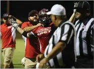  ?? RECORDER PHOTO BY CHIEKO HARA ?? An East player objects to the umpire’s ruling Saturday at the end of the fourth quarter of the 50th annual East vs West Tulare-kings All-star Football game.