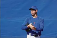  ?? Jeff Roberson/Associated Press ?? New York Mets pitcher Justin Verlander grips a ball during spring training practice on Feb. 20 in Port St. Lucie, Fla.