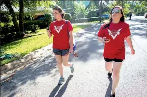  ?? Arkansas Democrat-Gazette/MELISSA SUE GERRITS ?? Arkansas Victory 365 volunteers LeFlore Barbour (left) and Alysson Humphrey use their GOP Data Center and Beacon phone app as they canvass a neighborho­od Saturday in Cammack Village.