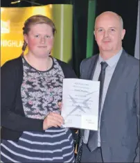  ?? IF F41 College Grad 02 ?? Jennifer MacInnes, left, receives the Scottish Qualificat­ions Authority college award from Graham Campbell of the Scottish Qualificat­ions Authority.