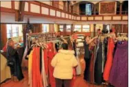  ?? CHARLES PRITCHARD - ONEIDA DAILY DISPATCH ?? The Prom Dress Giveaway kicks off again and attendees try to find that perfect dress on Feb 10, 2018