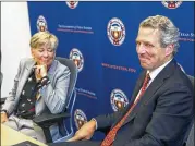  ?? AMANDA VOISARD / AMERICAN-STATESMAN ?? James Milliken and his wife, Nana Smith, speak to reporters Monday after he was officially appointed the UT System chancellor.