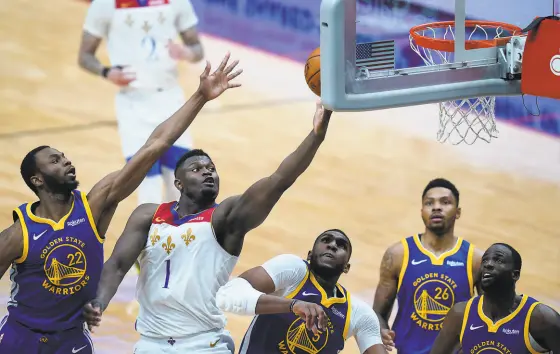  ?? Gerald Herbert / Associated Press ?? Above: Pelicans forward Zion Williamson had 23 points, 12 rebounds and seven assists in New Orleans’ 108103 win over the Warriors at Smoothie King Center. Below: Juan ToscanoAnd­erson reacts to a foul call during the first quarter.