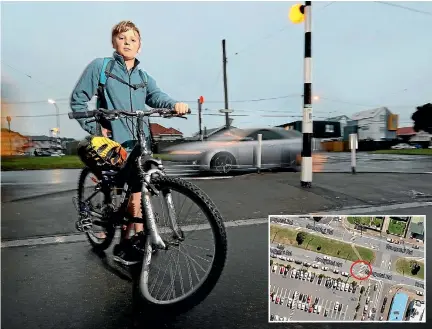  ?? PHOTO: CAMERON BURNELL/FAIRFAX NZ ?? Miguel Ferrer, 11, was hit by a car while on a pedestrian crossing in Ronogtai Rd – inset – on Monday. The crash ruined his bike tyre.