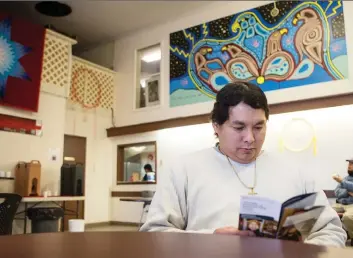  ?? LIAM RICHARDS ?? Jonathon Bird sits in the lobby of the Indian and Metis Friendship Centre during an informatio­n session on the Sixties Scoop settlement claims process in Saskatoon on Tuesday.