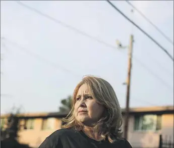  ?? Photograph­s by Dania Maxwell Los Angeles Times ?? DAISY VEGA, president of the resident advisory council at Mar Vista Gardens, accuses the Postal Service of planning changes at the complex because “we have people here that vote as Democrats.”