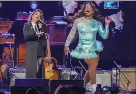  ?? PHOTO BY ED RODE — INVISION — AP ?? Maren Morris, left, and Alexia Noelle perform at “Love Rising,” a benefit concert for the Tennessee Equality Project, Inclusion Tennessee, OUTMemphis and The Tennessee Pride Chamber, on Monday at the Bridgeston­e Arena in Nashville, Tenn.