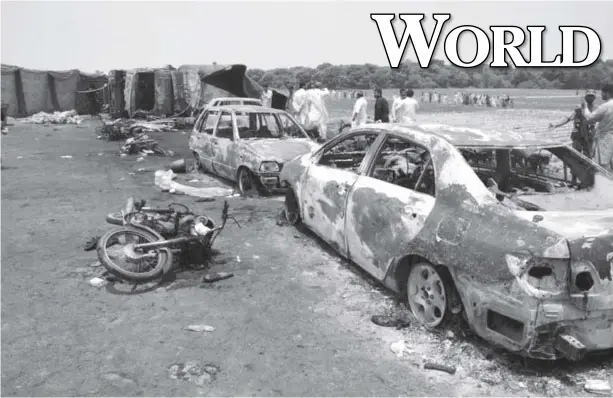  ?? REUTERS ?? Photo shows burned out cars and motorcycle­s after an oil fuel tanker exploded on Sunday in Pakistan.