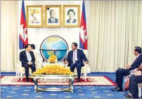  ?? FACEBOOK ?? Prime Minister Hun Sen appears with Jiang Jianguo, a member of the central committee of the Communist Party of China, at a meeting at the Peace Palace in Phnom Phnom Penh.