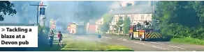  ?? ?? Tackling a blaze at a Devon pub