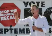  ?? PHOTOS BY RINGO H.W. CHIU — THE ASSOCIATED PRESS ?? Gov. Gavin Newsom speaks at a rally against the California gubernator­ial recall election in Sun Valley.