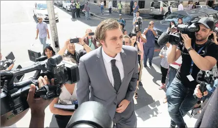  ?? PICTURE: COURTNEY AFRICA ?? CALM: Henri van Breda, accused of murdering three members of his family, enters the court yesterday.