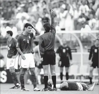  ?? Gary M. Prior Getty Images ?? RAFAEL MARQUEZ of Mexico is sent off by the referee for a foul on Cobi Jones during the 2-0 U.S. victory in the second round of the 2002 World Cup, a seminal moment in the rivalry.