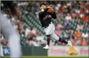  ?? ERIC CHRISTIAN SMITH — THE ASSOCIATED PRESS ?? Guardians shortstop Andres Gimenez attempts to throw out the Astros’ Yuli Gurriel during the sixth inning May 25. Gurriel was safe at first.