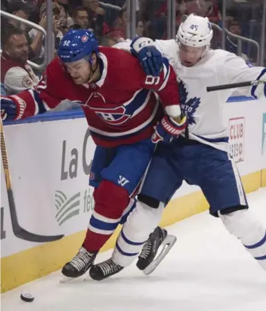  ?? JACQUES BOISSINOT/THE CANADIAN PRESS ?? The Leafs’ Miro Aaltonen works against Montreal’s Jonathan Drouin in a pre-season game in Quebec City. Toronto rebounded from a 2-0 deficit to beat the Canadiens 4-2.