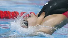  ?? CHRISTOPHE SIMON / AFP / GETTY IMAGES ?? Kylie Masse’s time of 58.18 seconds was just .06 seconds shy of the world record set by Gemma Spofforth in 2009.