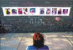  ?? Matt Rourke Associated Press ?? A MEMORIAL near the scene of last Saturday’s shooting at a market in Buffalo, N.Y. An 18-year-old is accused of murdering 10 people.