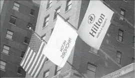  ?? Scott Olson ?? UNDER THE HILTON deal with HNA, Blackstone Group will keep an approximat­ely 21% interest in Hilton Worldwide Holdings. Above, a Hilton in Chicago.