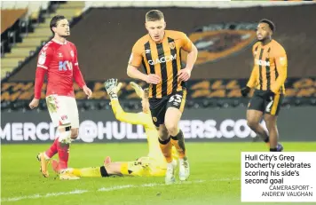  ?? CAMERASPOR­T - ANDREW VAUGHAN ?? Hull City’s Greg Docherty celebrates scoring his side’s second goal