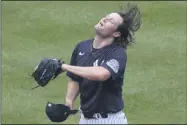  ?? KATHY WILLENS - THE ASSOCIATED PRESS ?? New York Yankees starting pitcher Gerrit Cole flips his hair before donning his cap between batters during an intrasquad game in baseball summer training camp Sunday, July 12, 2020, at Yankee Stadium in New York.