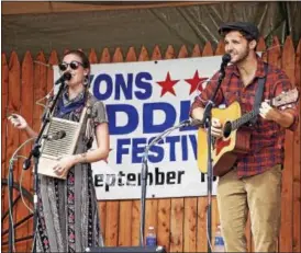  ??  ?? The 33rd annual Lyons Fiddle Festival on Sept. 18featured a variety of acts from near and far. After finding out one of the bands could not be at the festival, Larry Ross, stage manager, was on the phone the night before the festival and at 10p.m.,...