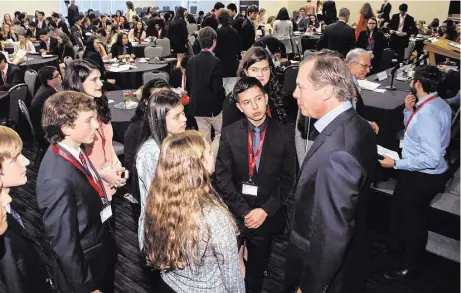  ?? Genesis Photograph­ers ?? Former Lieutenant Governor David Dewhurst chats with teens at the West Houston Teen Leadership Summit on Feb. 20. The event helped teens learn business fundamenta­ls from some top leaders in Texas.