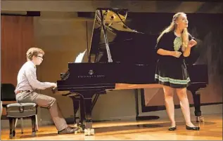  ?? Photog raphs by Anne Cusack Los Angeles Times ?? SOPRANO Erika Baikoff sings as Evan Roider plays piano during a SongFest master class.