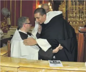  ??  ?? Fr Alan Adami embracing Fr. Hermann Duncan during his reception of the Dominican habit