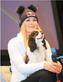  ?? AP-Yonhap ?? Lindsey Vonn of the United States holds her dog Lucy as she attends a news conference in Cortina D'Ampezzo, Italy, Wednesday.