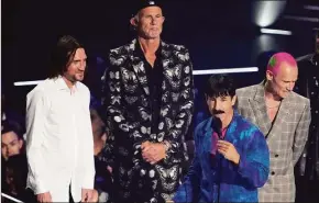  ?? Charles Sykes / AP ?? John Frusciante, Chad Smith, Anthony Kiedis and Flea. Fresh off a world tour and two albums this year, Red Hot Chili Peppers are preparing for a set of stadium shows and festival stops across North America and Europe in 2023.