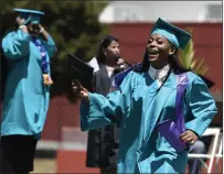  ?? ?? John Finney High graduate and valedictor­ian Tashaya Williams celebrates Wednesday afternoon with her Class of 2022in Vallejo.