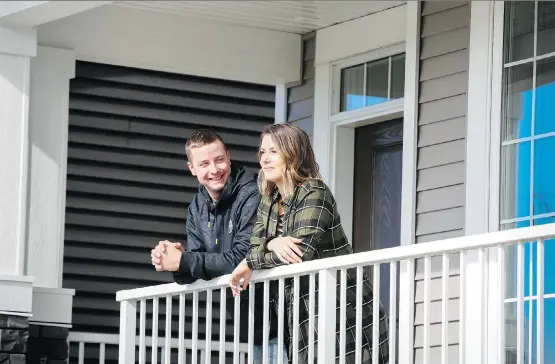  ?? CHRISTINA RYAN ?? Nikki Durstling and Colton Roy like the feeling of their new home in Crossfield’s Vista Crossing by Homes by Dream.