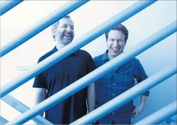  ?? Genaro Molina Los Angeles Times ?? “YOU HAVE to go through years of being awful” as a new comic, says Judd Apatow, left, with Pete Holmes.