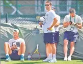  ?? AP ?? Rafael Nadal (L) takes a break during a practice session ahead of the Wimbledon Championsh­ips in London on Tuesday.