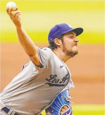  ?? DALE ZANINE/USA TODAY SPORTS ?? Los Angeles Dodgers starting pitcher Trevor Bauer is on paid administra­tive leave from MLB while he is embroiled in a court hearing regarding alleged violence against a young woman.