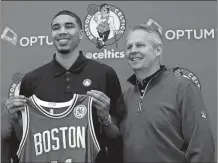  ?? CHARLES KRUPA/AP PHOTO ?? Boston Celtics first-round draft pick Jayson Tatum, left, poses with team president Danny Ainge on Friday at the team’s practice facility in Waltham, Mass.