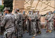  ?? BERNAT ARMANGUE / AP ?? Soldiers pause at a Spanish Constituti­on day rehearsal on Dec. 4. Spain’s defense minister has asked prosecutor­s to investigat­e leaked chats of retired officers allegedly talking about shooting political adversarie­s and praising late dictator Gen. Francisco Franco.